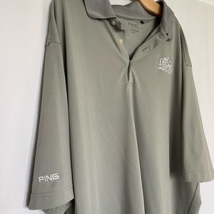 Grey polo by Ping. Front says “legacy golf club Arizona “ size XL